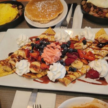 The Jagged Fork - Cloud Nine Three Sweet Crepes Stuffed With Strawberry Cream Cheese, Fresh Strawberries, Blueberries And Bananas, Topped With Berry Co - Breakfast & Brunch Near Me - Rochester Hills, Michigan The Jagged Fork - Cloud Nine Three Sweet Crepes Stuffed With Strawberry Cream Cheese, Fresh Strawberries, Blueberries And Bananas, Topped With Berry Co - Breakfast & Brunch Near Me - Rochester Hills, Michigan