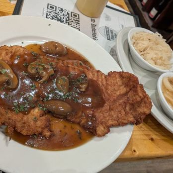 Mr. Dunderbak's - Jaeger schnitzel with hot German potato salad and sauerkraut - German Near Me - Tampa, Florida Mr. Dunderbak's - Jaeger schnitzel with hot German potato salad and sauerkraut - German Near Me - Tampa, Florida