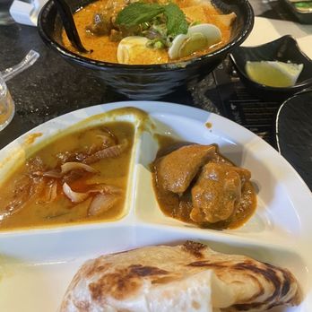 Food Terminal - Top: Curry Laksa Chicken Noodle Soup Bottom: Curry Boneless Chicken Roti Plate - Malaysian Near Me - Chamblee, Georgia
