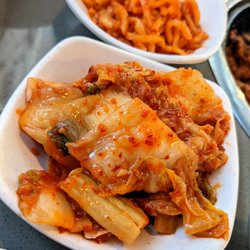 Kpop Bbq and Bar - Doraville - Kimchi and spicy sliced daikon radish banchan (Korean side dishes).