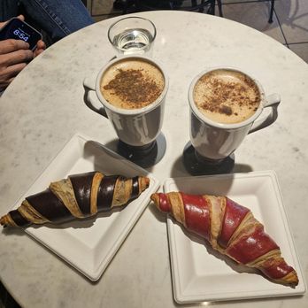 AM Market & Coffee - Duo chocolate croissant and raspberry croissant with cinnamon topped cappuccino lattes - Desserts Near Me - Ormond Beach, Florida AM Market & Coffee - Duo chocolate croissant and raspberry croissant with cinnamon topped cappuccino lattes - Desserts Near Me - Ormond Beach, Florida