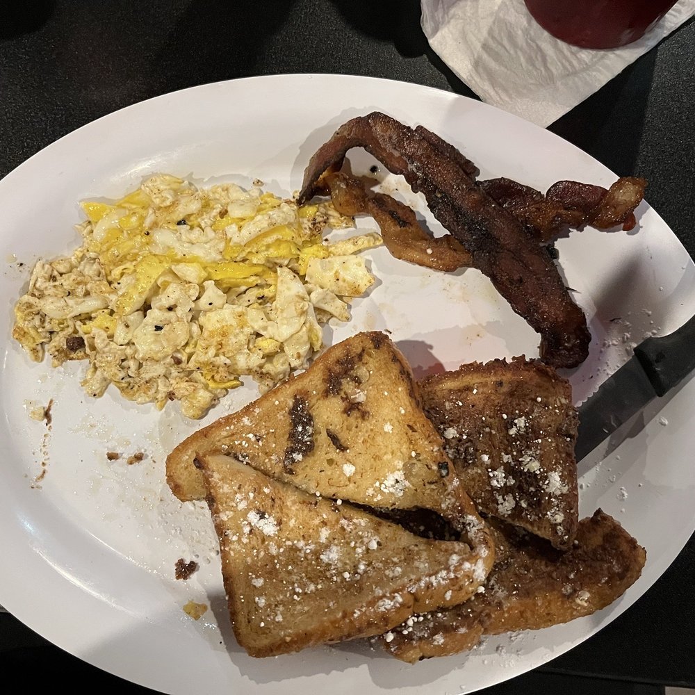 Soggy French toast with greasy burnt bacon and fried egg chopped up- asked for scrambled. Soggy French toast with greasy burnt bacon and fried egg chopped up- asked for scrambled.