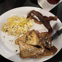 Soggy French toast with greasy burnt bacon and fried egg chopped up- asked for scrambled. Soggy French toast with greasy burnt bacon and fried egg chopped up- asked for scrambled.