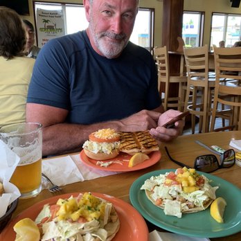Coconuts Fish Cafe - Mahi Mahi on a bun plus 2 Fish Tacos. Pretty wood wearing. Nice service as cafeteria style. - Seafood Near Me - Kihei, Hawaii