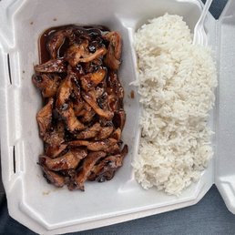 a container of rice and meat