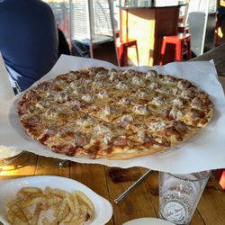 Villa Nova Pizzeria - New Buffalo - On the patio, it's cozy and warm in here with sausage pizza!