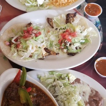 Brothers & Beer - Carnitas chimichanga, two fish tacos, and steak molcajete - Mexican Near Me - Lexington, South Carolina Brothers & Beer - Carnitas chimichanga, two fish tacos, and steak molcajete - Mexican Near Me - Lexington, South Carolina