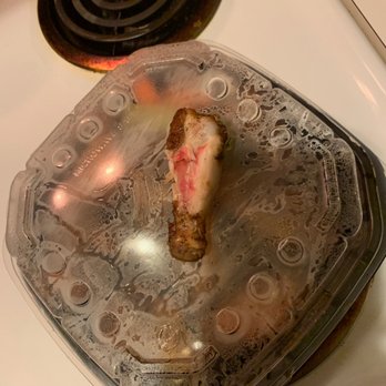 Milwaukee Brat House - I ordered the Jamaican Dry Rub and this was my first bite..... Raw still bleeding  Totally Killer Wings - German Near Me - Shorewood, Wisconsin