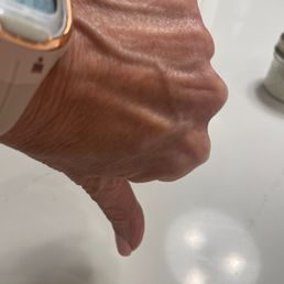 a person's wrist with a digital watch a person's wrist with a digital watch