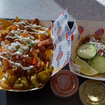Tacos Los Carnales - chorizo nachos and a (happy) carne asada taco - Mexican Near Me - Montclair, California Tacos Los Carnales - chorizo nachos and a (happy) carne asada taco - Mexican Near Me - Montclair, California