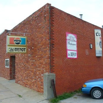 Depot Tavern - a blue car parked in front of a red brick building - Dive Bars Near Me - Richmond, Missouri Depot Tavern - a blue car parked in front of a red brick building - Dive Bars Near Me - Richmond, Missouri