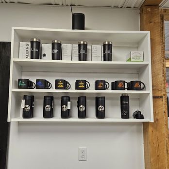 Baba Java Coffee - a shelf of coffee mugs - Coffee & Tea Near Me - Montevallo, Alabama