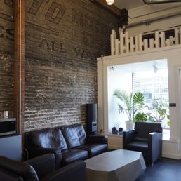 Finished photos at Dark Water Tattoo in Berkeley of the matte black concrete flooring