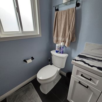 Glenn Construction - Vince removed a wall and replaced it with a custom cabinet with dual hampers inside - General Contractors Near Me