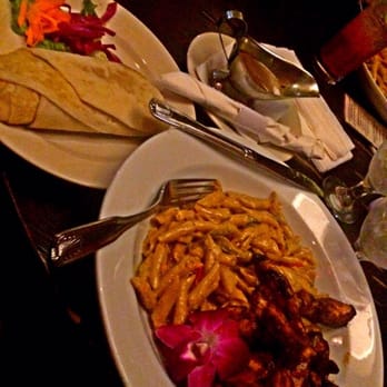 Footprints Cafe - jerk chicken w/ rasta pasta and a side of roti w/ curry goat gravy - Bars Near Me - Brooklyn, New York Footprints Cafe - jerk chicken w/ rasta pasta and a side of roti w/ curry goat gravy - Bars Near Me - Brooklyn, New York