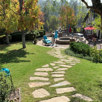 Solena Landscape - Flagstone steps gracefully meander downhill from upper concrete deck to spa patio. What serenity! - Landscaping Near Me - Huntington Beach, California Solena Landscape - Flagstone steps gracefully meander downhill from upper concrete deck to spa patio. What serenity! - Landscaping Near Me - Huntington Beach, California