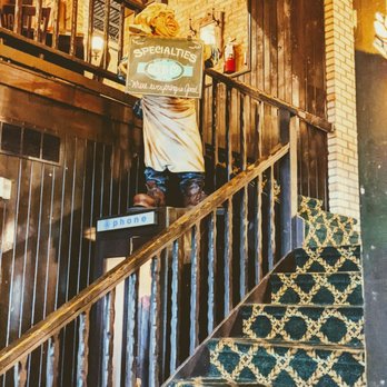 Good Company - a man standing on the stairs of a restaurant - American Near Me - Appleton, Wisconsin