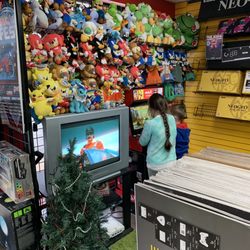 Game Over Videogames - Wall of stuffed animals and demo in action