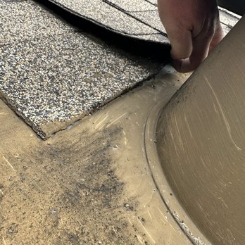 Gentry Construction - Before repair where area around vent was overpainted - Roofing Near Me