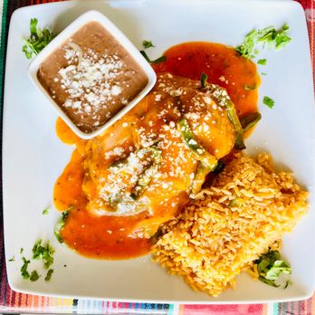 Los Tres Compadres - Chile Relleno nestled by rice and beans - Mexican Near Me - Kingston, Washington Los Tres Compadres - Chile Relleno nestled by rice and beans - Mexican Near Me - Kingston, Washington
