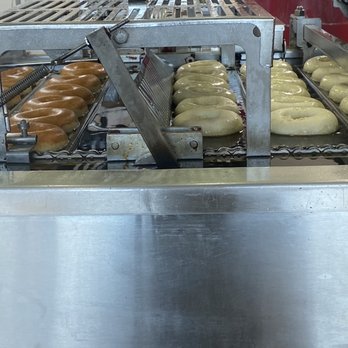 Krispy Kreme - Freshly fried glazed donuts on the conveyer - Coffee & Tea Near Me - Jacksonville, Florida Krispy Kreme - Freshly fried glazed donuts on the conveyer - Coffee & Tea Near Me - Jacksonville, Florida