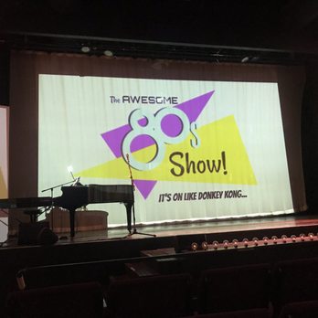 Badgett Playhouse - a stage with a piano and microphone - Dinner Theater Near Me - Grand Rivers, Kentucky Badgett Playhouse - a stage with a piano and microphone - Dinner Theater Near Me - Grand Rivers, Kentucky