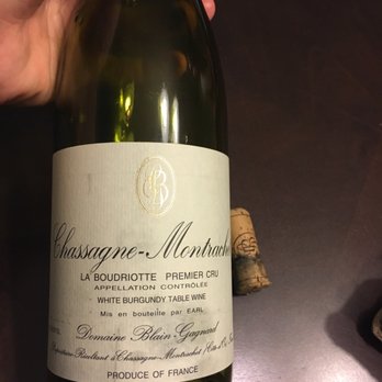 Wine Central - a hand holding a bottle of wine - Beer, Wine & Spirits Near Me - Warren, New Jersey