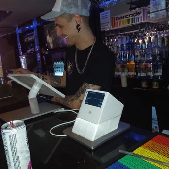 Barcode - a man working at a bar - Bars Near Me - Houston, Texas