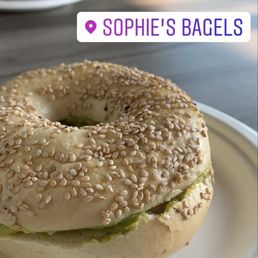 Sesame seed bagel with the avocado mash