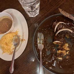 Mole Enchilada's chicken was plentiful throughout enchilada. Rice cooked to perfection and refried beans did not taste of lard. Mole Enchilada's chicken was plentiful throughout enchilada. Rice cooked to perfection and refried beans did not taste of lard.