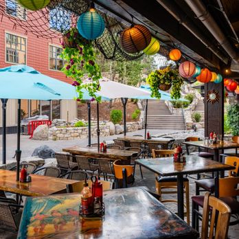 Lakanuki - a patio with tables and umbrellas - Tiki Bars Near Me - Mammoth Lakes, California Lakanuki - a patio with tables and umbrellas - Tiki Bars Near Me - Mammoth Lakes, California