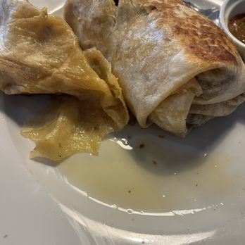 Farm Table - Puddle of butter/grease from the breakfast burrito. This was just from one half of the burrito. - Breakfast & Brunch Near Me - Van Nuys, California Farm Table - Puddle of butter/grease from the breakfast burrito. This was just from one half of the burrito. - Breakfast & Brunch Near Me - Van Nuys, California