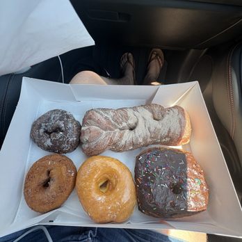 Peterson's Donut Corner - Cinnamon sugar twist, glazed donut, chocolate pillow, cake donut, and blueberry donut - Donuts Near Me - Escondido, California Peterson's Donut Corner - Cinnamon sugar twist, glazed donut, chocolate pillow, cake donut, and blueberry donut - Donuts Near Me - Escondido, California