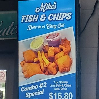 Mike's Fish & Chips - Digital ad board - The digital ad board for Mike's Fish & Chips showcases a meal combo including fried fish, shrimp, and chips, with dipping sauces. The ad highlights dine-in or carry-out options, with a price of $16.80. Additional details include a QR code, contact number, and promotional text to advertise the restaurant's offerings. - Fish & Chips Near Me - Payson, Arizona