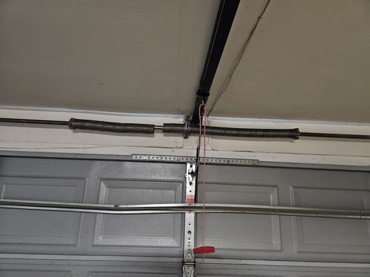 Broken torsion spring repair - Customers door would not open due to broken spring. We went out got the weight of the weigh of the door and replaced the stock springs with our high cycle springs with a 6 year parts warranty and a 3 year labor warranty Broken torsion spring repair - Customers door would not open due to broken spring. We went out got the weight of the weigh of the door and replaced the stock springs with our high cycle springs with a 6 year parts warranty and a 3 year labor warranty