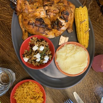 Nando's - whole chicken with 4 sides: corn, grains, mashed, rice - Fast Food Near Me - Derby, DER Nando's - whole chicken with 4 sides: corn, grains, mashed, rice - Fast Food Near Me - Derby, DER