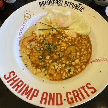 Breakfast Republic - SHRIMP & GRITS BREAKFAST gouda cheese infused grits and shrimp cooked with br cluckin' good hot sauce, fresh sweet corn, and chives - Breakfast & Brunch Near Me - Irvine, California