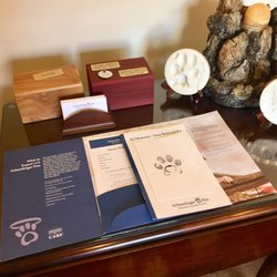 Schoedinger Midtown - Standard pet cremation package is a wooden urn with nameplate, paw print, lock of hair, and grieving literature.