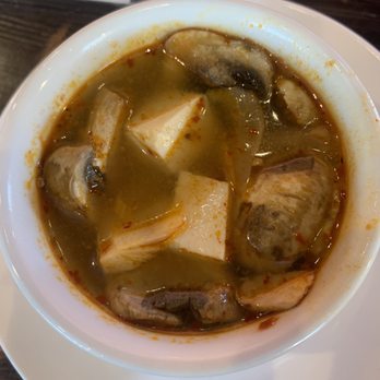 Thai Cuisine - Tofu Tom Yum with mushrooms from the lunch appetizer buffet. - Thai Near Me - Austin, Texas Thai Cuisine - Tofu Tom Yum with mushrooms from the lunch appetizer buffet. - Thai Near Me - Austin, Texas