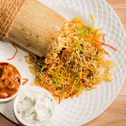 Mc's curry - Rice and meat mixed in unique Indian spices stuffed into a piece of raw bamboo and then steamed.