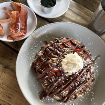 Bulegreen Cafe Yard - OMG Waffle with a side of bacon. - Cafes Near Me - Oakland Park, Florida Bulegreen Cafe Yard - OMG Waffle with a side of bacon. - Cafes Near Me - Oakland Park, Florida