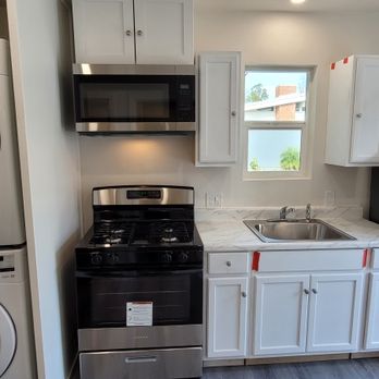 Dyna-Cap Builders - ADU garage conversion kitchenette. Working space = 2 car garage 400 sq. ft. - Electricians Near Me - Anaheim, California Dyna-Cap Builders - ADU garage conversion kitchenette. Working space = 2 car garage 400 sq. ft. - Electricians Near Me - Anaheim, California