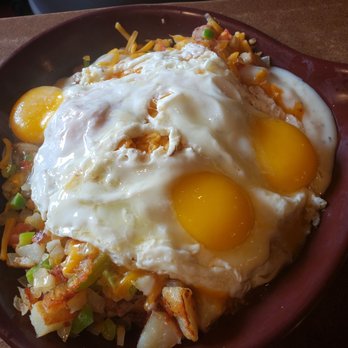 Round the Clock - a plate of fried eggs and hash browns - New American Near Me - Schererville, Indiana