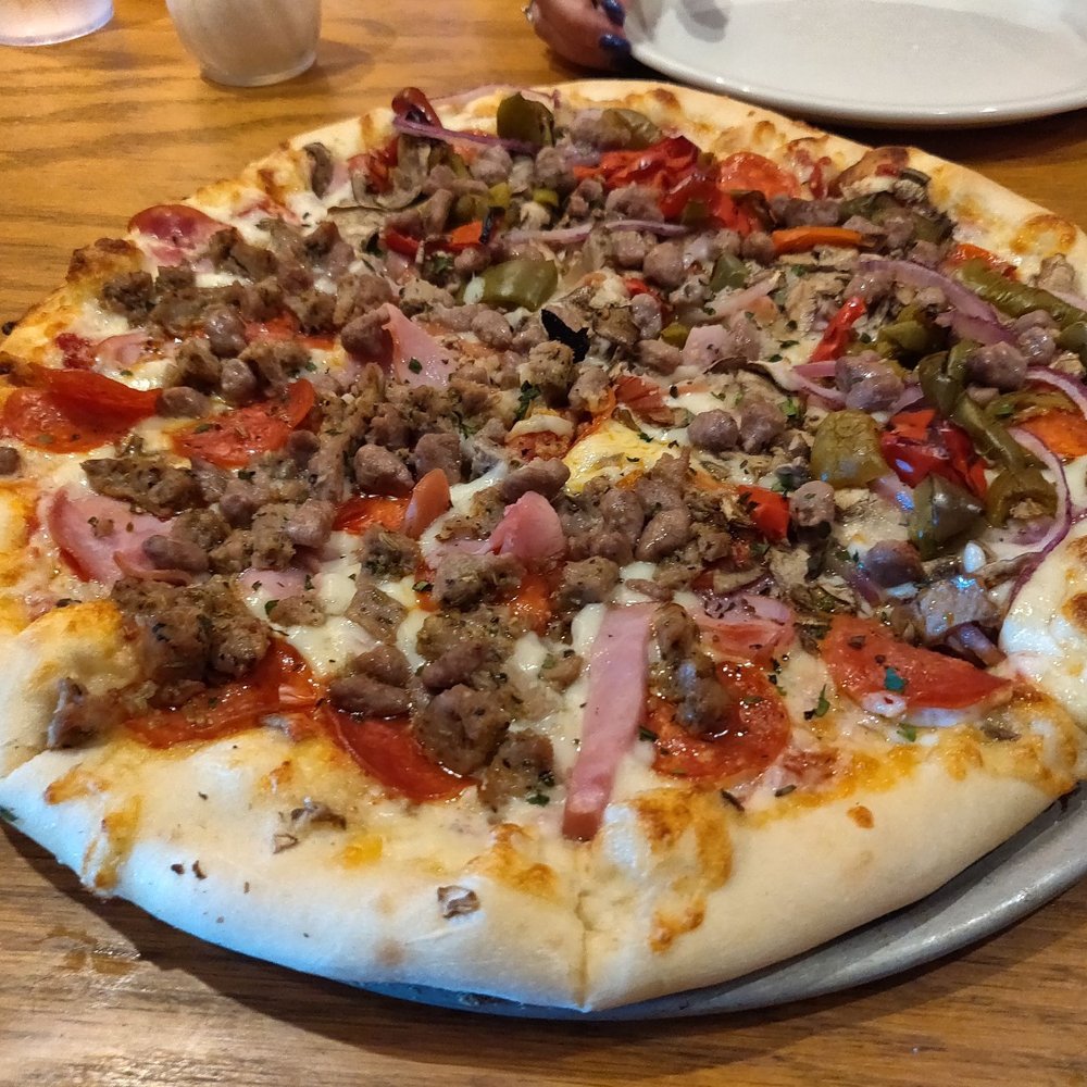Pizza Bella - 1/2 Meat lovers, 1/2Bella Supreme - Pizza Near Me - Katy, Texas