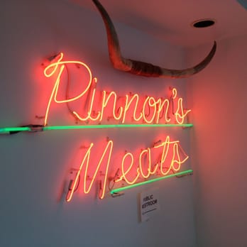 Pinnon's Meats - a neon sign on a wall - Meat Shops Near Me - Beloit, Wisconsin Pinnon's Meats - a neon sign on a wall - Meat Shops Near Me - Beloit, Wisconsin