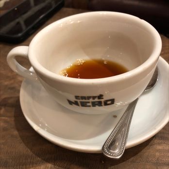 Caffè Nero - a cup of coffee on a saucer - Coffee & Tea Near Me - Concord, Massachusetts