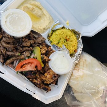 Chef Moussa - a tray of meat and rice - Mediterranean Near Me - Peoria, Illinois Chef Moussa - a tray of meat and rice - Mediterranean Near Me - Peoria, Illinois