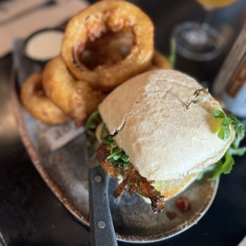 The State - pesto chicken sandwich: chicken breast, asiago, apple-wood smoked bacon, arugula, pesto sauce on ciabatta roll = $16 - New American Near Me - Redlands, California
