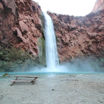 Havasu Falls - Through some tunnels and down some ladders you'll find this bench to take a break on. Mooney falls. - Hiking Near Me