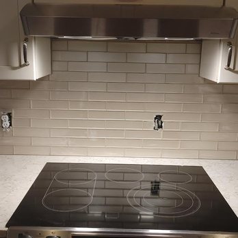 K&S Homes and Remodeling - a kitchen with a stove and range hood - General Contractors Near Me